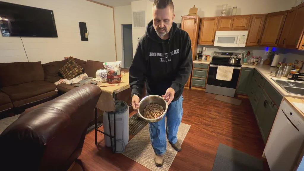 ryan holding bowl of freeze dried cubes