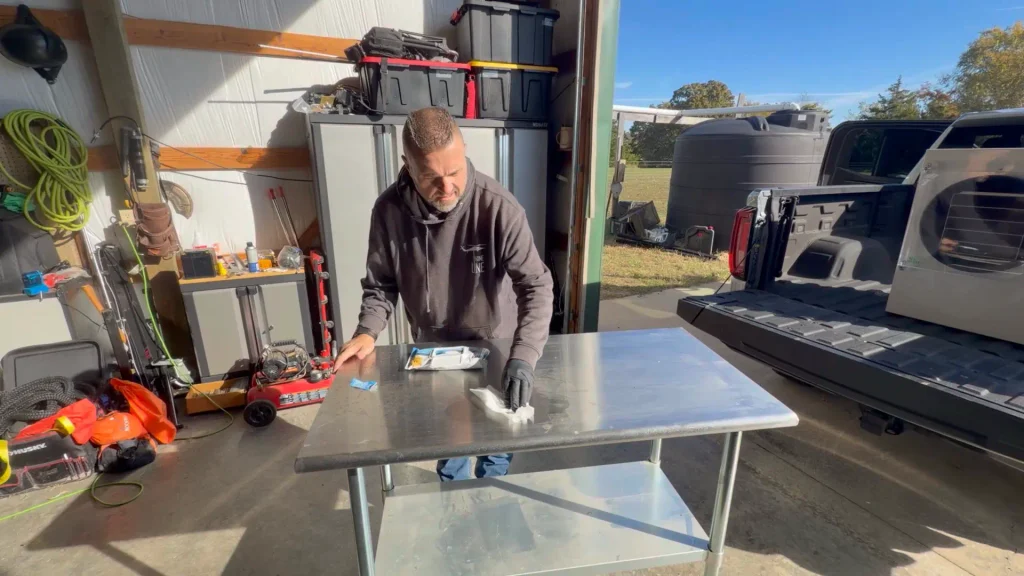 ryan wiping stainless shop table