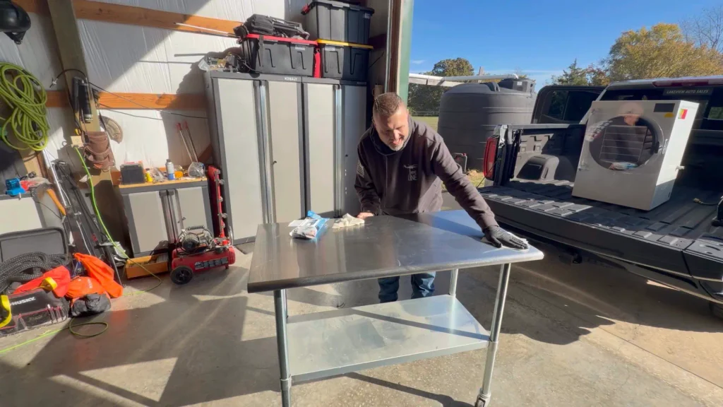 ryan wiping stainless table edge