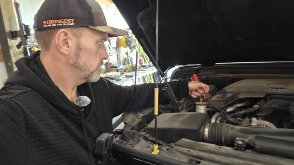 ryan checking jeep engine in shop